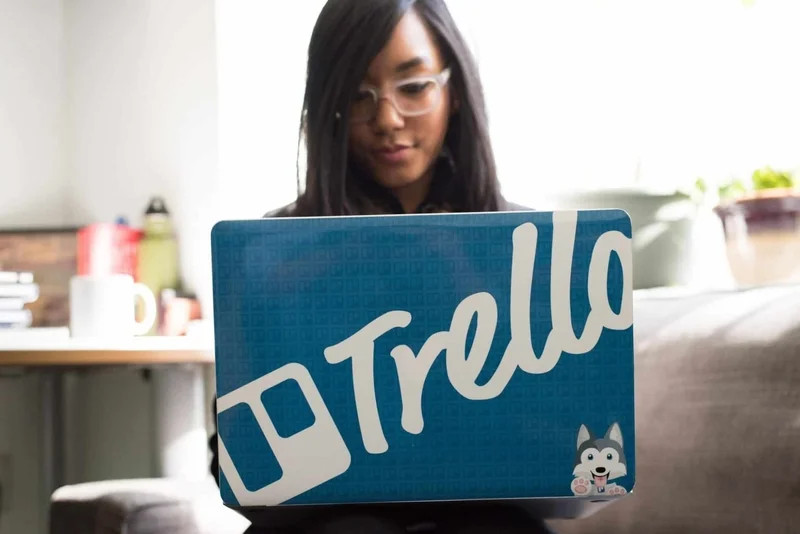 Laptop with a text Trello on it