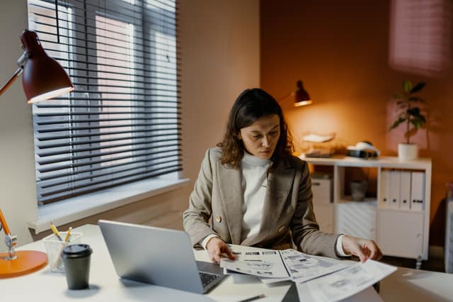 Woman working with paper in office
