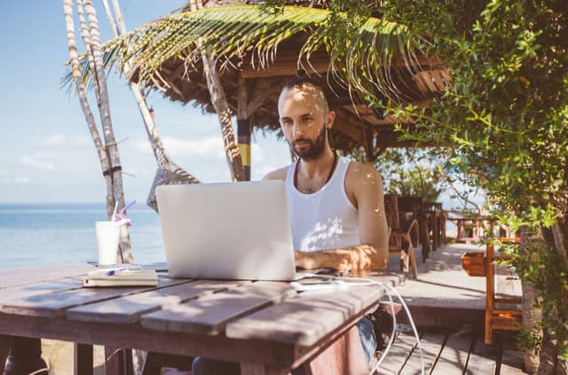 person working remotely from beach