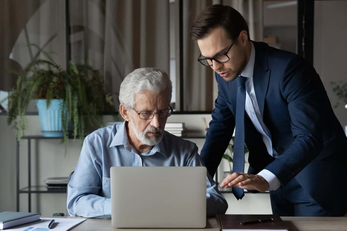 IT manager helping his boss