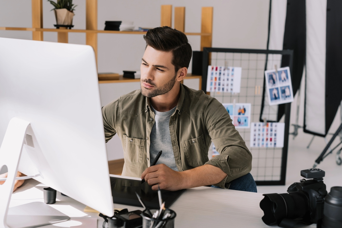 Senior Graphic Designer working on computer testimonial