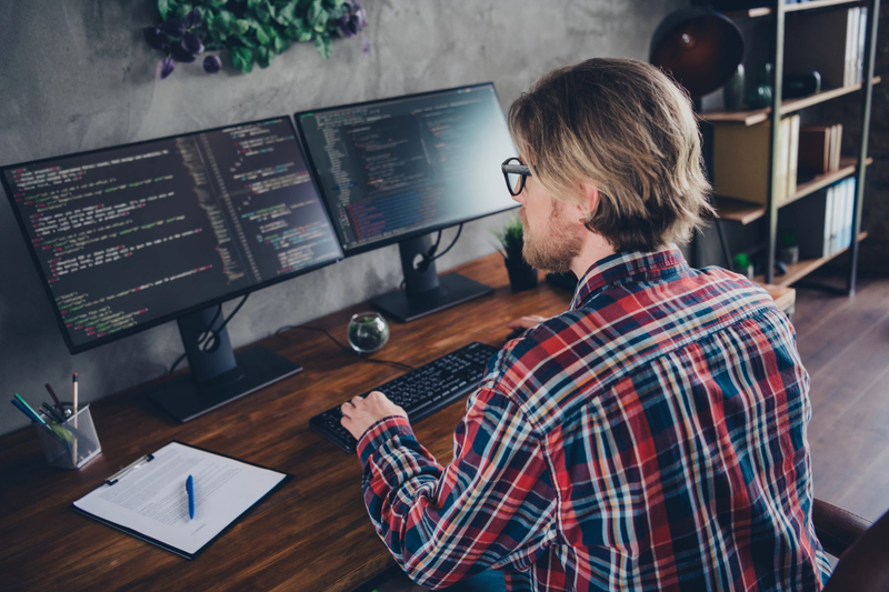 Developer working on the computer, main image