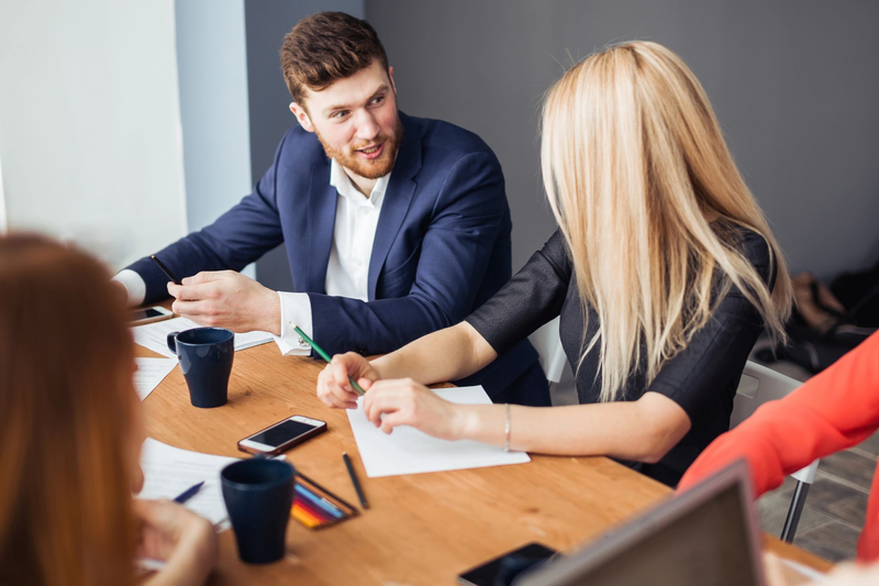 Startup owner at the meeting with professionals from an established recruitment agency.